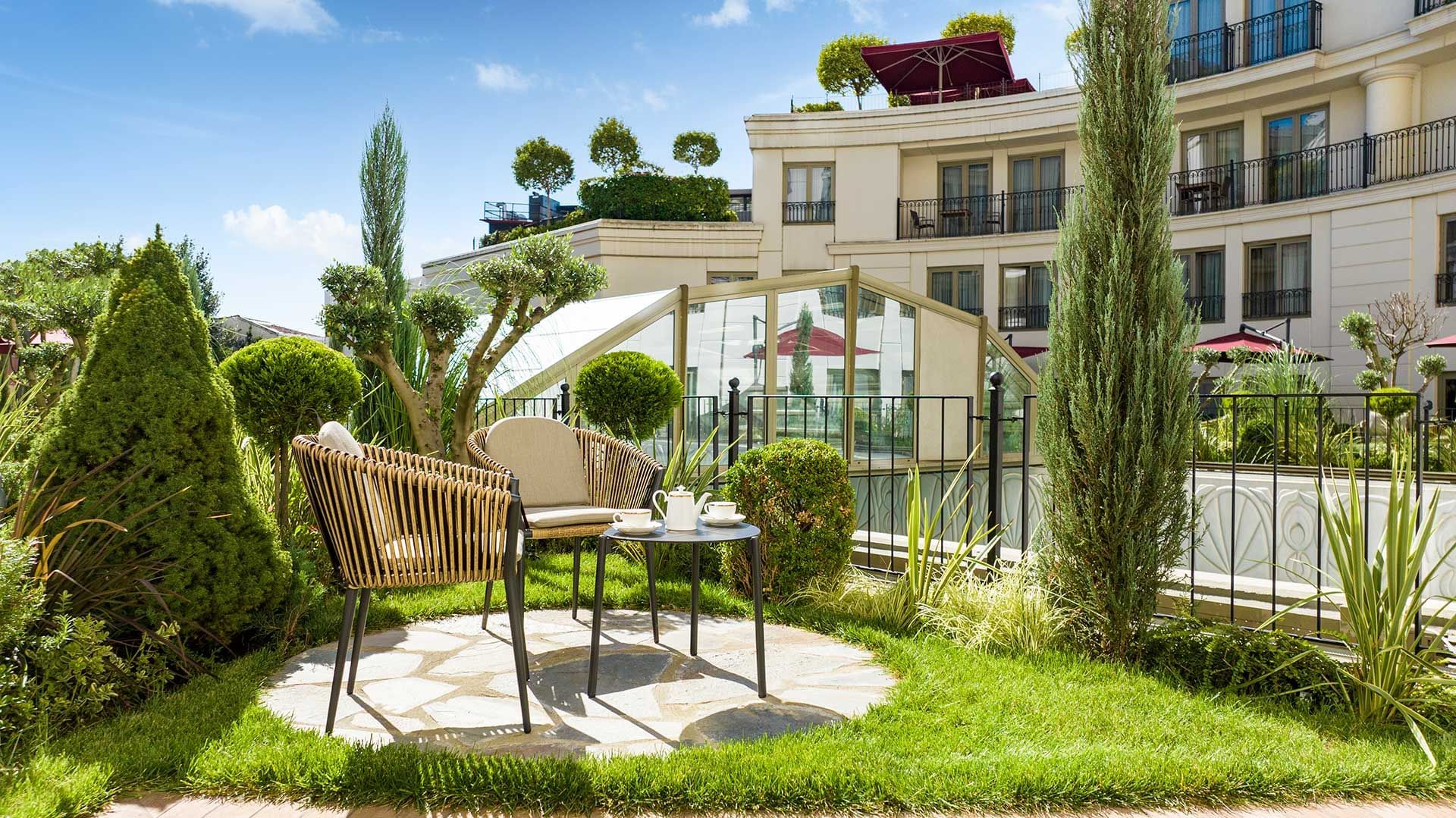 Cozy outdoor seating area with tea set.